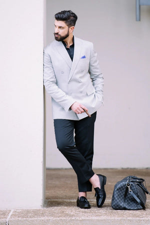 grey coat with black shirt